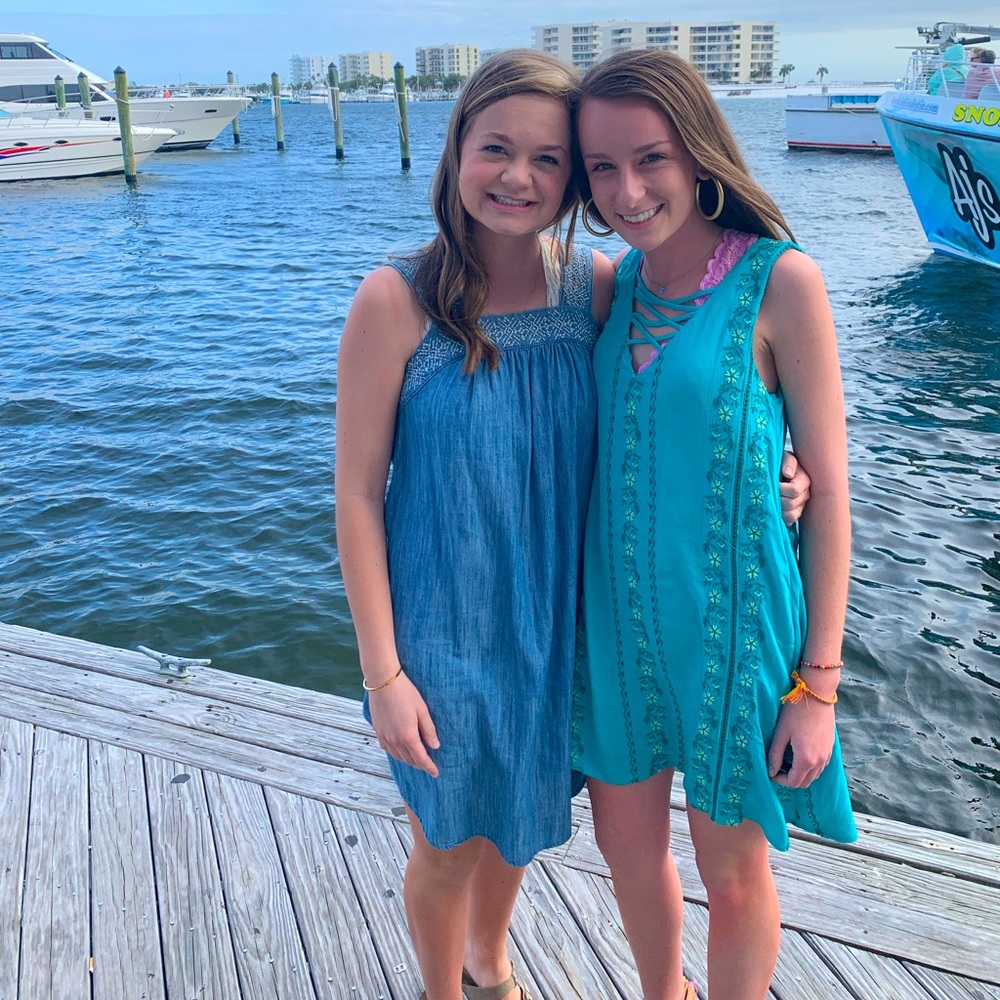 Blue dress on the left with beautiful embroidery!